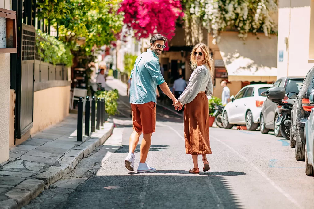 A couple walking through Plaka, Athens
